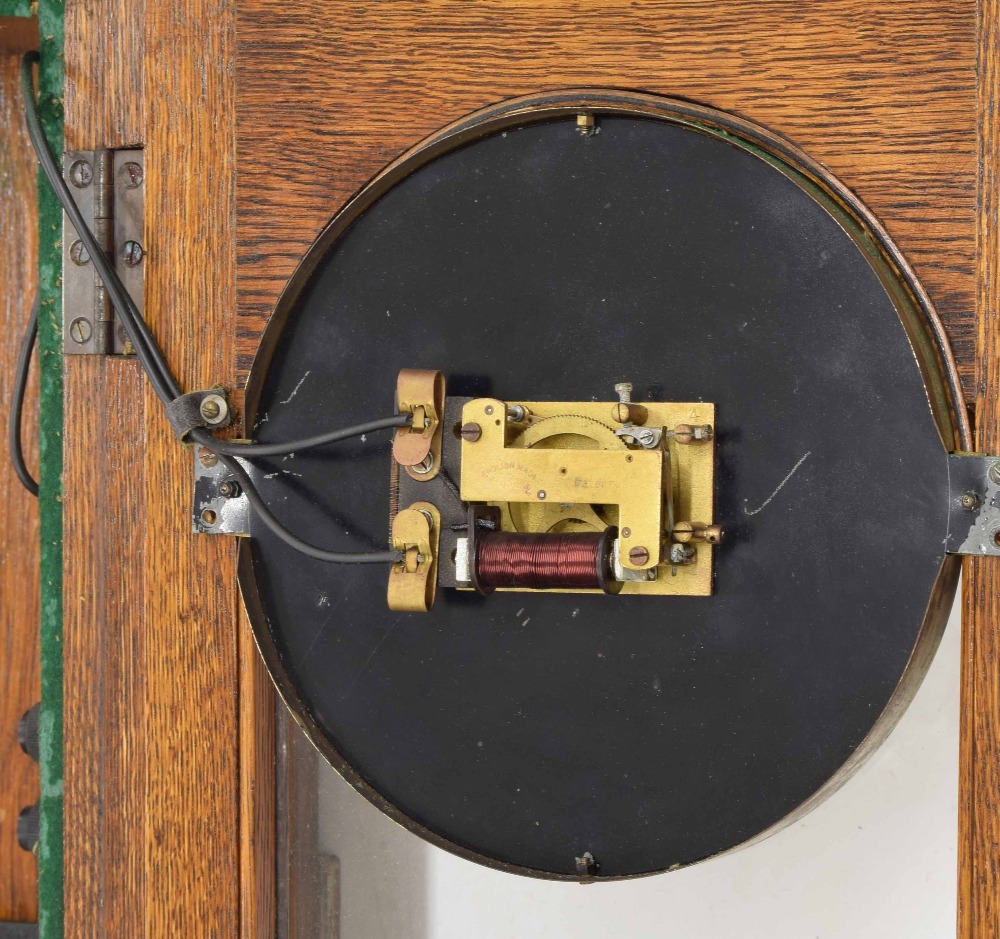 Rare Synchronome synchronous mains electric wall clock, the 6.25" silvered dial within an oak ste