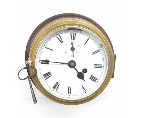 Brass ship's bulkhead wall clock, the 6" white dial with subsidiary seconds dial and slow/fast lever, within a brass casing w