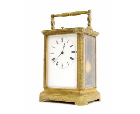 Repeater carriage clock striking on a bell, within a foliate engraved brass case, 6.75" high