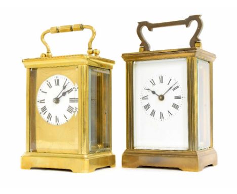 Carriage clock timepiece within a brass case, 6" high; also another brass carriage clock timepiece, the 1.75" white dial with