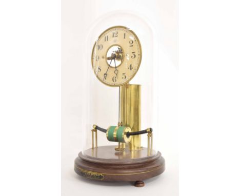 Electric mantel clock, the 5.25" cream dial bearing the maker's trademark logo MFB and enclosing a skeletonised centre, under