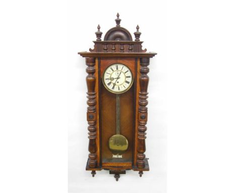 Walnut single weight Vienna regulator wall clock, the 7" cream dial with subsidiary seconds dial, within a glazed and turned 