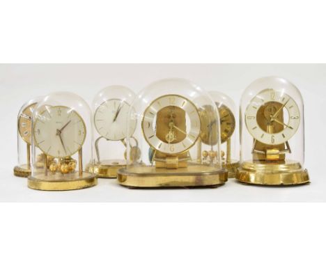 Kundo electric mantel clock, under a Perspex dome, 9.5" high; also five other various gilt metal cased electric mantel clocks