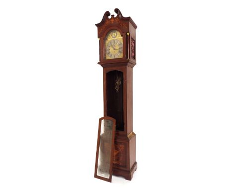 Mahogany three train musical longcase clock playing on tubular bells, the 12" brass arched dial with silvered chapter ring en