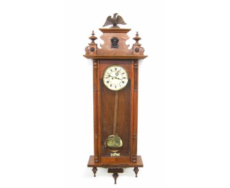 Walnut double weight Vienna regulator wall clock, the 6.25" cream dial within a pillared glazed case, 41" high (pendulum, two