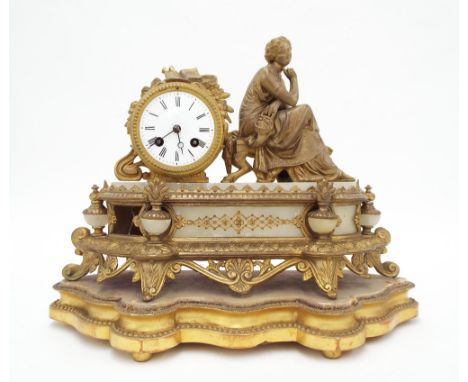 French spelter and alabaster two train drumhead figural mantel clock, upon a shaped giltwood stand, 13.5" high