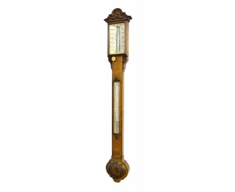 Good oak stick barometer/thermometer signed Davis, Leeds on the angled ivory plate, over a flat trunk fitted with a thermomet