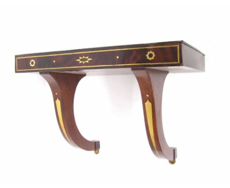 Good flame mahogany clock bracket inlaid with geometric brass motifs and lines, 16" wide, 9.25" deep overall