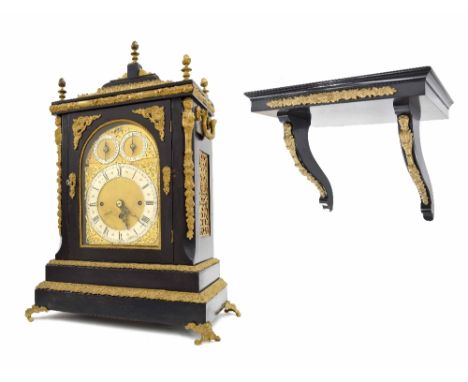 English ebonised triple fusee boardroom mantel clock and bracket, the 8" brass arched dial with silvered chapter ring enclosi