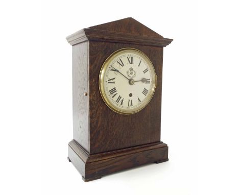 RAF oak cased single fusee mantel clock, the 5.5" convex white dial bearing the RAF logo, the movement back plate inscribed M