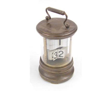 Cylindrical brass ticket clock with carrying handle, 6.5" high