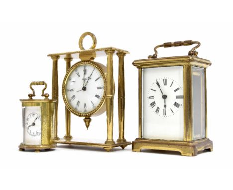 Carriage clock timepiece, within a brass corniche case, 5.75" high (key); also a small Swiza portico brass alarm clock and a 