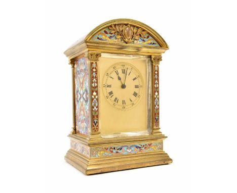 Good small ormolu and champleve decorated two train carriage/mantel clock, the movement striking on a gong and the back plate