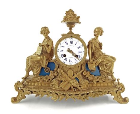 French ormolu drumhead two train figural mantel clock, the 3.5" white dial signed Paul Mancel á Paris, also signed again on t