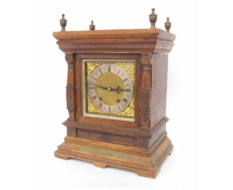 German oak ting-tang mantel clock, the W & H movement striking on two gongs, the 7" square brass dial with silvered chapter r