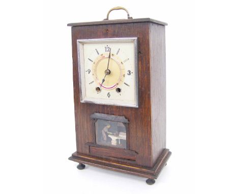 Oak cased automaton two train mantel clock striking on a bell, the 4.25" square silvered dial fitted with a thermometer, over