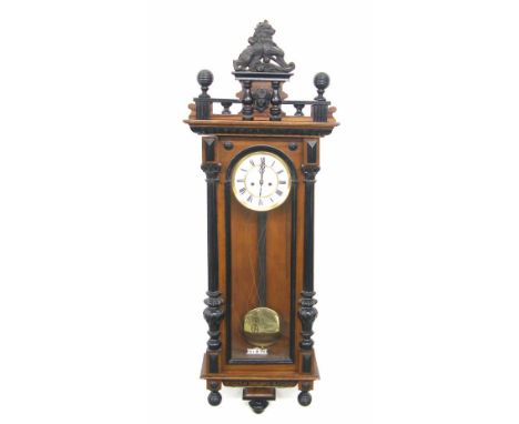 Walnut and ebonised double weight Vienna regulator wall clock, the 6.25" white dial within a glazed pillared case, 51" high (