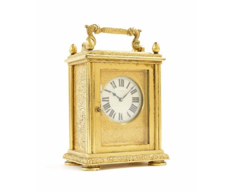 Unusual heavy gilt brass carriage clock timepiece, the 1.75" cream dial within a fine foliate engraved case, 5.25" high