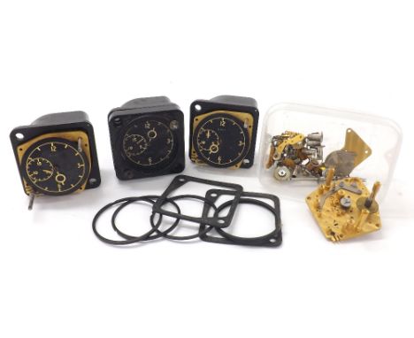 Three 8 day aircraft clocks for repair or spares; together with a selection of aircraft clock parts