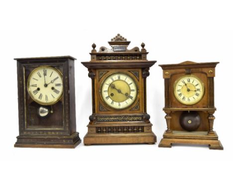 German two train mantel clock striking on a gong, within an architectural stepped carved case, 17" high; also an Ansonia 'Lon