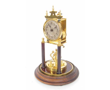 Early brass torsion clock, the 2.75" silvered dial over a disc pendulum, under a glass dome and upon a stepped mahogany base,