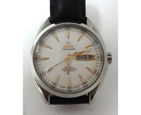 A near new Gents Omega Seamaster Co Axial, Chronometer wrist watch, 500 feet with calendar, with warranty card dated 31st May
