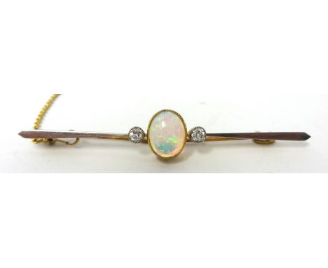 Antique 18 carat gold and platinum opal with one old cut diamond set either side mounted in millegrain settings platinum fron