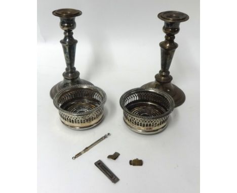 Pair Elkington EP candlesticks, pair silver plated small bottle coasters, silver swizle stick, tie clip