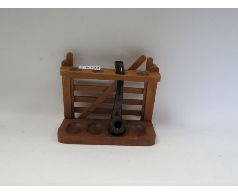 A wooden gate form pipe rack and a pipe 