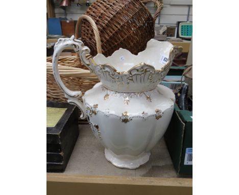 A ceramic white and gilt wash jug 