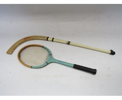 A Gray's of Cambridge miniature tennis racket and a Hazell's miniature hockey stick (2)