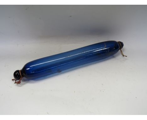 A blue glass rolling pin 