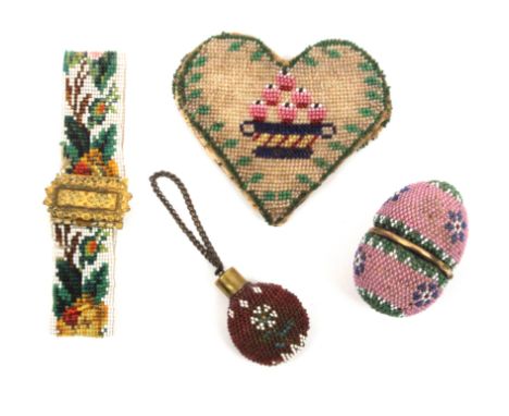 A beadwork covered egg form etui, and three other pieces, the etui with pink beaded ground, the lid interior with mirror over