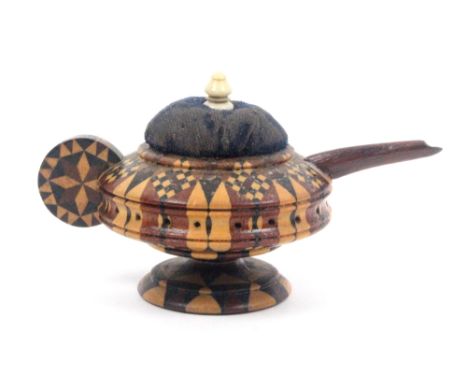 A Tunbridge ware pin cushion in the form of a teapot, in turned stick ware with roundel form handle, shaped mahogany spout, t