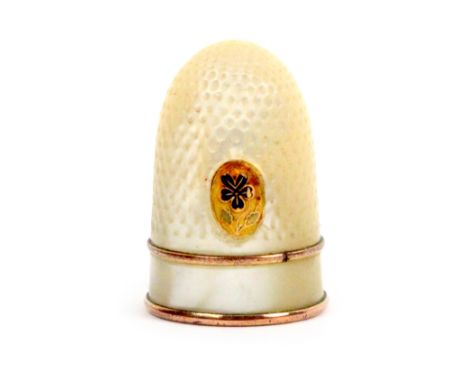 A mother of pearl Palais Royal thimble with gilt metal and enamel pansy motif, the plain frieze within copper gilt bands, sma