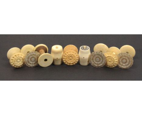 Reels and cotton barrels comprising a set of three mother of pearl top reels with brass stems on bone bases, 3.5cm, a further