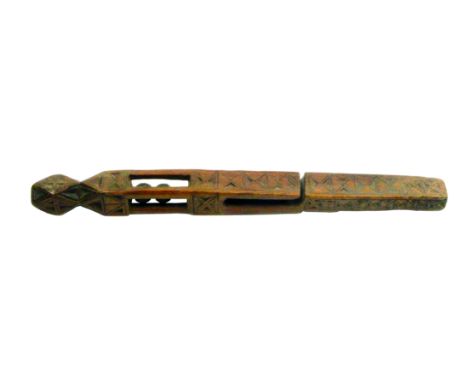 A late 18th Century English wooden knitting stick, probably Welsh, of square tapering section with chip carved decoration and