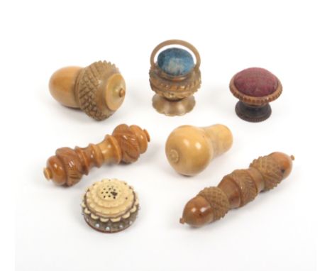 Seven vegetable ivory sewing tools comprising a pear shaped thimble case, 5cm, another of acorn form with reel and needle cas