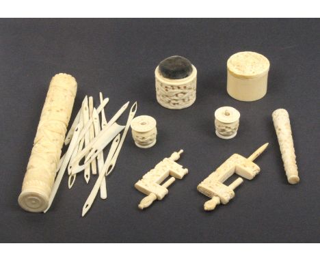 A group of 19th Century Chinese carved ivory sewing tools comprising a cylinder netting case carved with dragon and birds, co