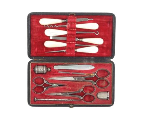 An English sewing companion, circa 1850, contained in a black leather rectangular tooled case, the lower section flush fitted
