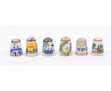 Six silver and enamel thimbles by James Swann and Son, comprising two chinoiserie style examples, a Bovril advertising exampl