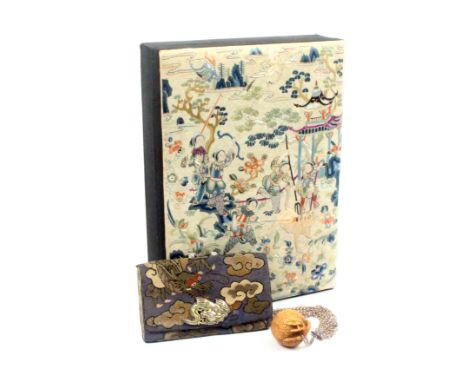 A knot work Tabako-Ire (tobacco pouch) decorated with a dragon amid clouds, dragon clasp below an ojime to eighteen chains an