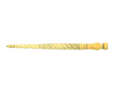 A late 18th Century Dutch ivory knitting stick, the baluster form aperture below a spiral turned stem to a finial, wear and c