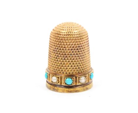A 15ct gold thimble the frieze set with a band of alternate turquoise and pearl coloured stones in rectangular mounts over a 