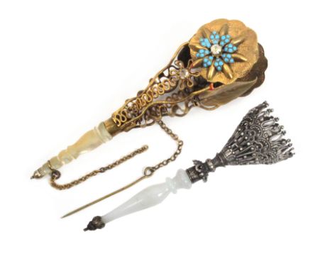Two mid-19th Century posy holders comprising a pierced silver example with glass stem and metal terminal, 11.5cm and an elabo
