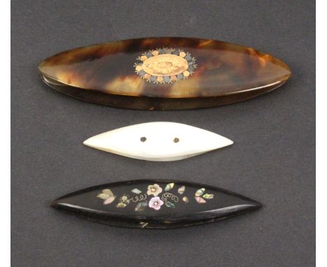 Three 19th Century shuttles comprising a tortoiseshell example each side inlaid in gold and coloured metals with an engraved 