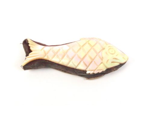 A mother of pearl pin cushion in the form of a fish one side carved and engraved to represent a fish, worn velvet infill, 6.5