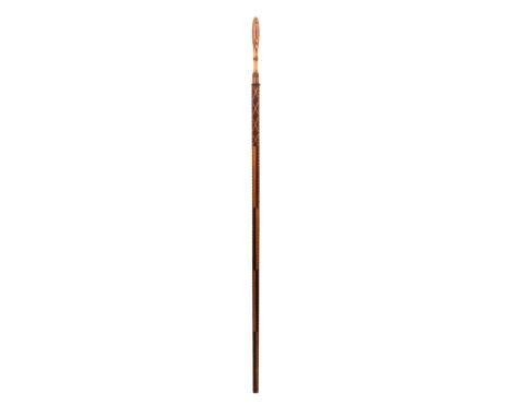 An early 19th Century Dutch wooden ellemaat or measuring stick elaborately inlaid, the handle of baluster form in stick ware 
