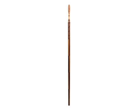 An early 19th Century Dutch wooden ellemaat or measuring stick elaborately inlaid, the handle of baluster form in stick ware 