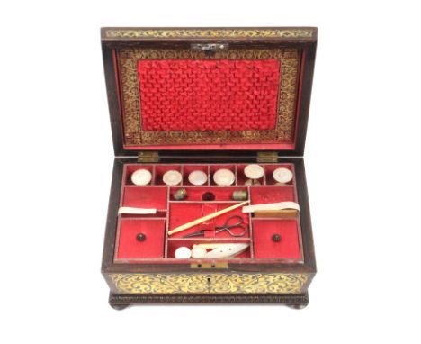 A rosewood and brass inlaid sewing box of sarcophagal form, circa 1835, the lid and front with cut brass floral panels and qu